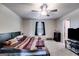 The bedroom boasts plush carpeting and a ceiling fan for added comfort at 1018 Nandina Ct, Villa Rica, GA 30180