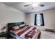 This bedroom features neutral walls, carpeted floors, and a ceiling fan at 1018 Nandina Ct, Villa Rica, GA 30180