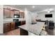 Modern kitchen featuring granite countertops, dark cabinets, and stainless steel appliances at 1018 Nandina Ct, Villa Rica, GA 30180