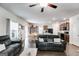 Open-concept living space with dark wood floors and a view of the kitchen and dining area at 1018 Nandina Ct, Villa Rica, GA 30180