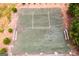 Aerial view of an outdoor tennis court with benches at 1018 Nandina Ct, Villa Rica, GA 30180