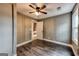 Bedroom with gray walls, hardwood floors and ceiling fan at 106 Hillside Se Ave, Atlanta, GA 30315