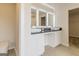Modern bathroom with dual vessel sinks, granite countertop, framed mirrors, and a separate toilet room at 189 Orwell Dr # 47, Social Circle, GA 30025