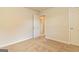 Neutral bedroom with carpet, cream walls, white door and trim, and an open doorway to another room at 189 Orwell Dr # 47, Social Circle, GA 30025