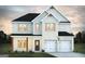 Charming two-story home with a white brick exterior and a two-car garage, showcasing a modern design at 189 Orwell Dr # 47, Social Circle, GA 30025