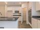 Well-equipped kitchen with granite counters, stainless steel appliances, ample cabinet space, and a convenient pantry at 189 Orwell Dr # 47, Social Circle, GA 30025