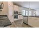 Modern kitchen with stainless steel appliances, granite countertops, white cabinets, and open layout for easy entertaining at 189 Orwell Dr # 47, Social Circle, GA 30025