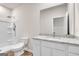 Well-lit bathroom with granite counters, modern fixtures, and a walk-in shower at 271 Orwell Dr # 49, Social Circle, GA 30025
