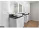 Modern bathroom featuring double sinks, illuminated mirrors, and a sleek countertop at 271 Orwell Dr # 49, Social Circle, GA 30025