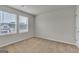 Bedroom featuring neutral carpeting and two windows providing natural light at 271 Orwell Dr # 49, Social Circle, GA 30025