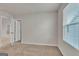 Bright and airy bedroom with window and neutral carpet at 271 Orwell Dr # 49, Social Circle, GA 30025