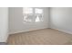 Bright bedroom with two windows allowing natural light to illuminate the space at 271 Orwell Dr # 49, Social Circle, GA 30025