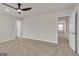 Spacious bedroom featuring neutral carpeting, ceiling fan, and ample natural light at 271 Orwell Dr # 49, Social Circle, GA 30025