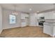Kitchen area with stainless appliances and granite countertops open to dining area at 271 Orwell Dr # 49, Social Circle, GA 30025