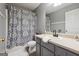 Bathroom featuring grey cabinets, a large decorative shower curtain, and a white sink at 349 Majestic Run, Temple, GA 30179