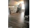 Large bonus room with sloped ceiling and wood-look flooring, perfect for workout space at 25 Franklin Way, Covington, GA 30016