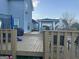 Spacious back deck with fenced railing, outside seating, and partially enclosed living space at 25 Franklin Way, Covington, GA 30016