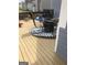 Covered outdoor patio area for entertaining with table, chairs, fire pit, and decorative mat at 25 Franklin Way, Covington, GA 30016