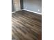 This bedroom boasts gray walls, white trim, and dark hardwood flooring for a modern design at 25 Franklin Way, Covington, GA 30016