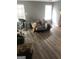 Spacious bedroom features wood-look floors, gray walls, and windows that provide natural lighting at 25 Franklin Way, Covington, GA 30016