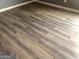 This bedroom has gray walls, white trim, and light hardwood flooring at 25 Franklin Way, Covington, GA 30016