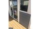 Outdoor patio area with sliding glass door, gray siding, and wood flooring at 25 Franklin Way, Covington, GA 30016