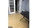 Outdoor patio space has french doors leading to inside. Has table, cooler, and stone fruit bowl at 25 Franklin Way, Covington, GA 30016