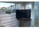 A sunroom view with a Samsung television on a wooden table at 25 Franklin Way, Covington, GA 30016
