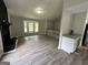 Living room with fireplace, wood-look floors and loft area at 2961 Forelock Sw Pl, Marietta, GA 30064