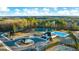 Extensive aerial view of community featuring a pool, tennis courts and playground at 1678 Lacebark Elm Way, Lawrenceville, GA 30045