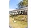 View of the private backyard with a gentle slope and neighboring houses in the distance from the window at 1678 Lacebark Elm Way, Lawrenceville, GA 30045