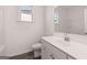 Bathroom with modern vanity, white countertop, toilet, framed mirror, and a shower/tub combination at 1678 Lacebark Elm Way, Lawrenceville, GA 30045