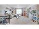 Spacious bonus room with ample seating, built-in shelving, and natural light at 1678 Lacebark Elm Way, Lawrenceville, GA 30045
