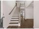 Grand entryway with a staircase and hardwood flooring at 1678 Lacebark Elm Way, Lawrenceville, GA 30045