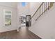 Bright entryway with a staircase and natural light streaming in at 1678 Lacebark Elm Way, Lawrenceville, GA 30045