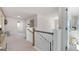 Second floor hallway with views to other rooms, carpet, and modern decor at 1678 Lacebark Elm Way, Lawrenceville, GA 30045