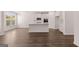 Bright, open kitchen with an island and modern appliances at 1678 Lacebark Elm Way, Lawrenceville, GA 30045