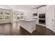 Open kitchen featuring stainless steel appliances and a large island at 1678 Lacebark Elm Way, Lawrenceville, GA 30045