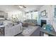 Spacious living room with lots of natural light, neutral walls, carpet, and modern fireplace at 1678 Lacebark Elm Way, Lawrenceville, GA 30045