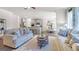 Inviting living room seamlessly connects to the kitchen and dining area in an open-concept layout at 1678 Lacebark Elm Way, Lawrenceville, GA 30045