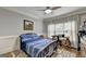 Bright bedroom with a comfortable bed, built-in desk, and plenty of natural light at 2118 Town Manor Ct, Dacula, GA 30019