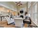 Two-story living room with hardwood floors, fireplace, and abundant natural light at 2118 Town Manor Ct, Dacula, GA 30019