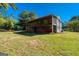 Wide backyard shot with a view of the spacious screened porch at 6671 Pelica Ct, Riverdale, GA 30274