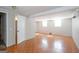 Basement features tile flooring, bright windows, and doorway to another space at 6671 Pelica Ct, Riverdale, GA 30274