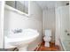 This bathroom features a classic sink and toilet at 6671 Pelica Ct, Riverdale, GA 30274