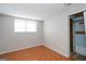 Bedroom with tile floors, closet with sliding doors, and large window at 6671 Pelica Ct, Riverdale, GA 30274