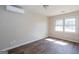Bright, airy bedroom with wood-look floors, a mini split, and natural light at 6671 Pelica Ct, Riverdale, GA 30274