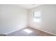 A carpeted bedroom featuring a window and neutral walls at 6671 Pelica Ct, Riverdale, GA 30274