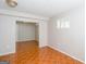 View of bedroom with light-colored walls and glossy tile floors through a doorway at 6671 Pelica Ct, Riverdale, GA 30274