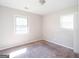 A carpeted bedroom featuring natural light at 6671 Pelica Ct, Riverdale, GA 30274